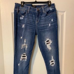 Just Blue distressed jeans with camo details.